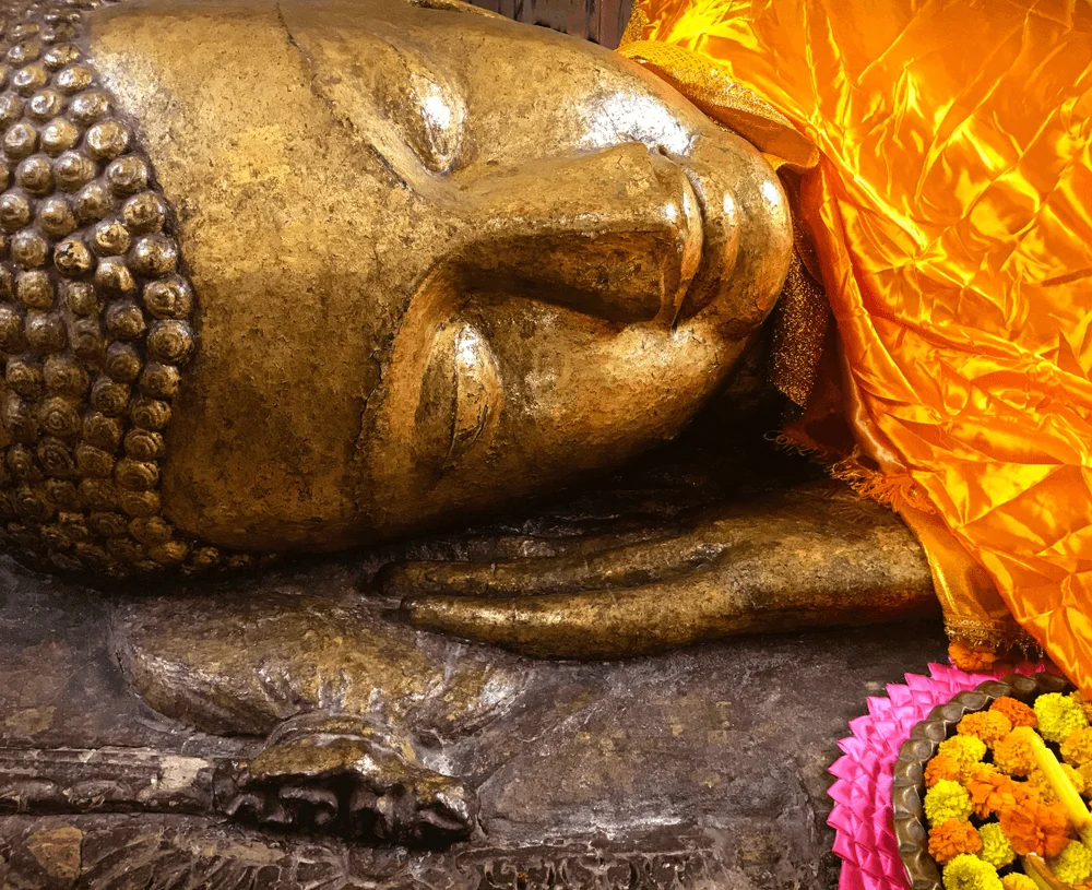 CloseUp Buddha Statue At Parinirvana Stupa