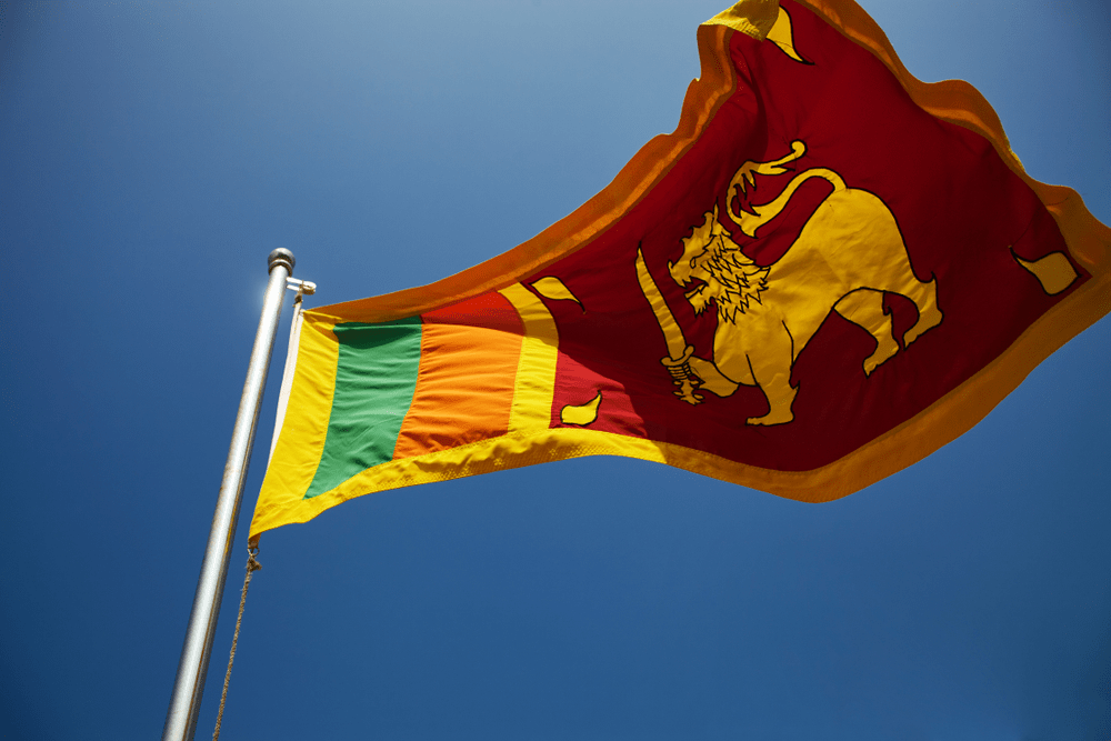 Close up Sri Lanka flag against blue sky