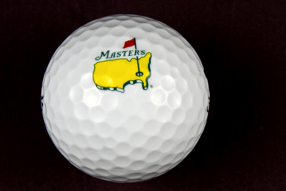 Masters Tournament logo on a golf ball with black background
