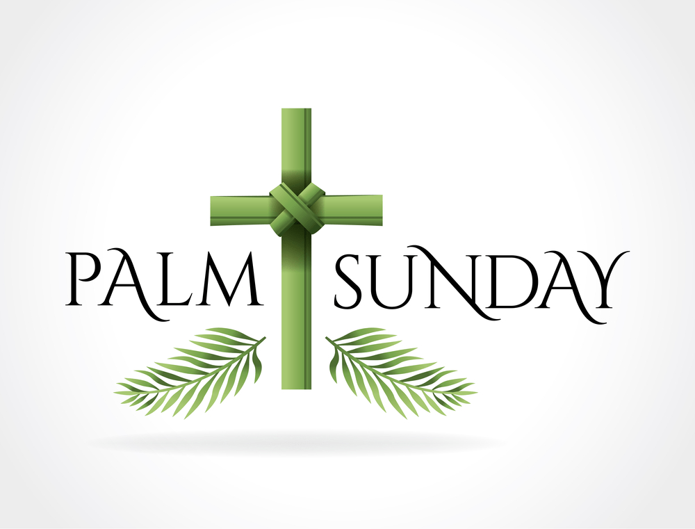 A Christian Palm Sunday religious holiday with palm branches and leaves and cross