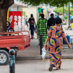 People walking on the streets of Brazzaville, Congo Republic, West Africa. Traditional clothes outfit for women walking on the street