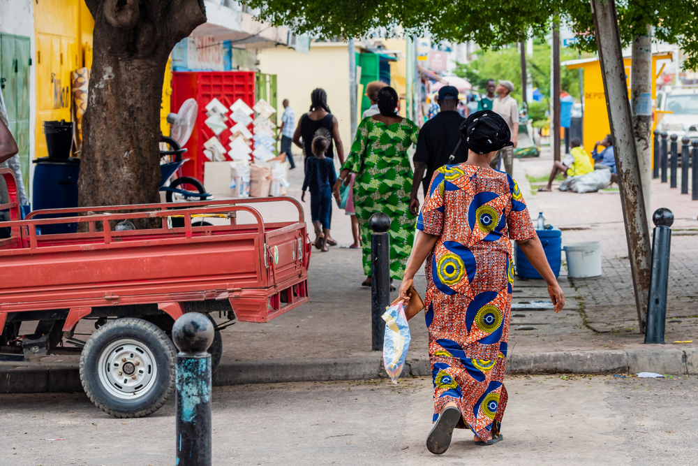People walking on the streets of Brazzaville Congo Republic West Africa Traditional clothes outfit for women walking on the street