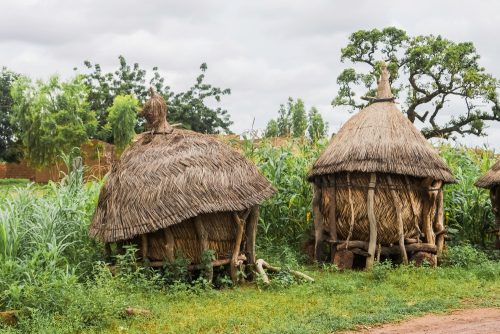 Two traditional african granaries made of wood and straw, Ouagadougou, Burkina Faso